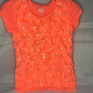 Bright peach/reddish Orange shirt with silver flap designs